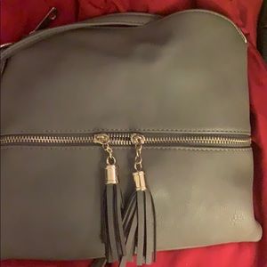 Gray purse with fringe zipper